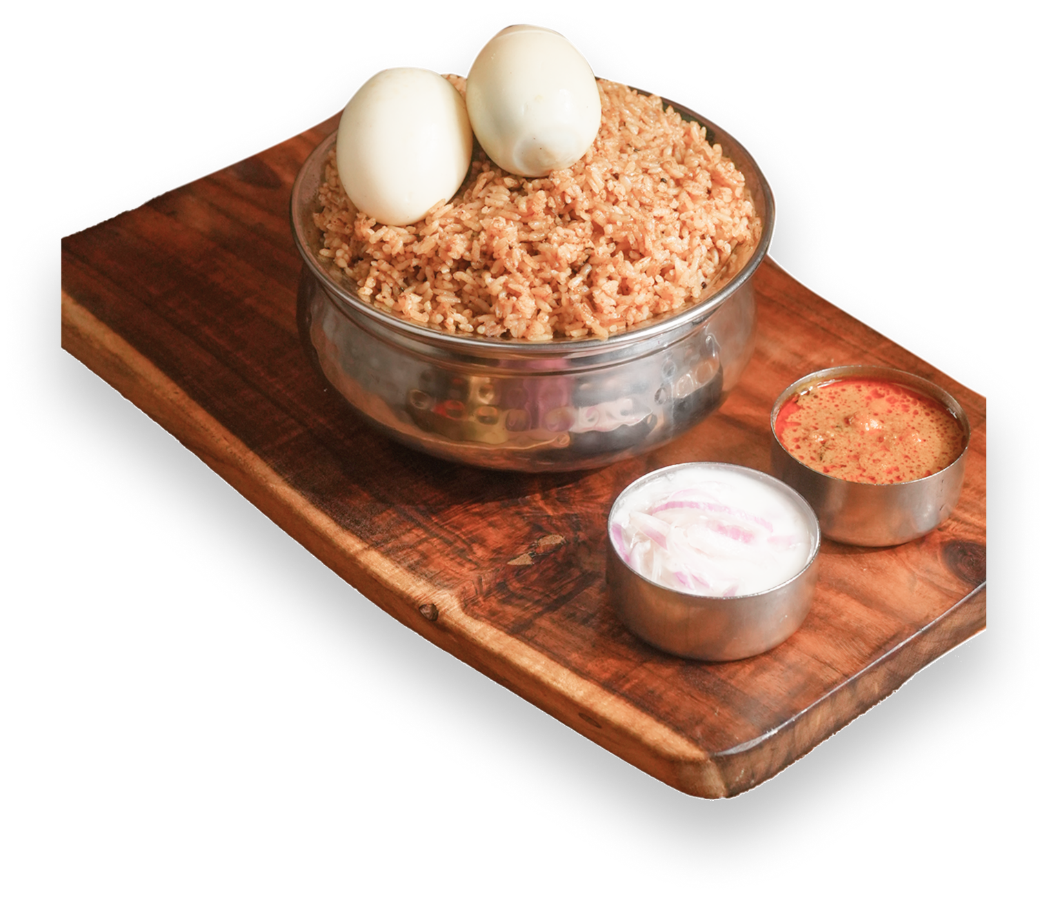 Egg Biriyani with boiled eggs and accompaniments on wooden board